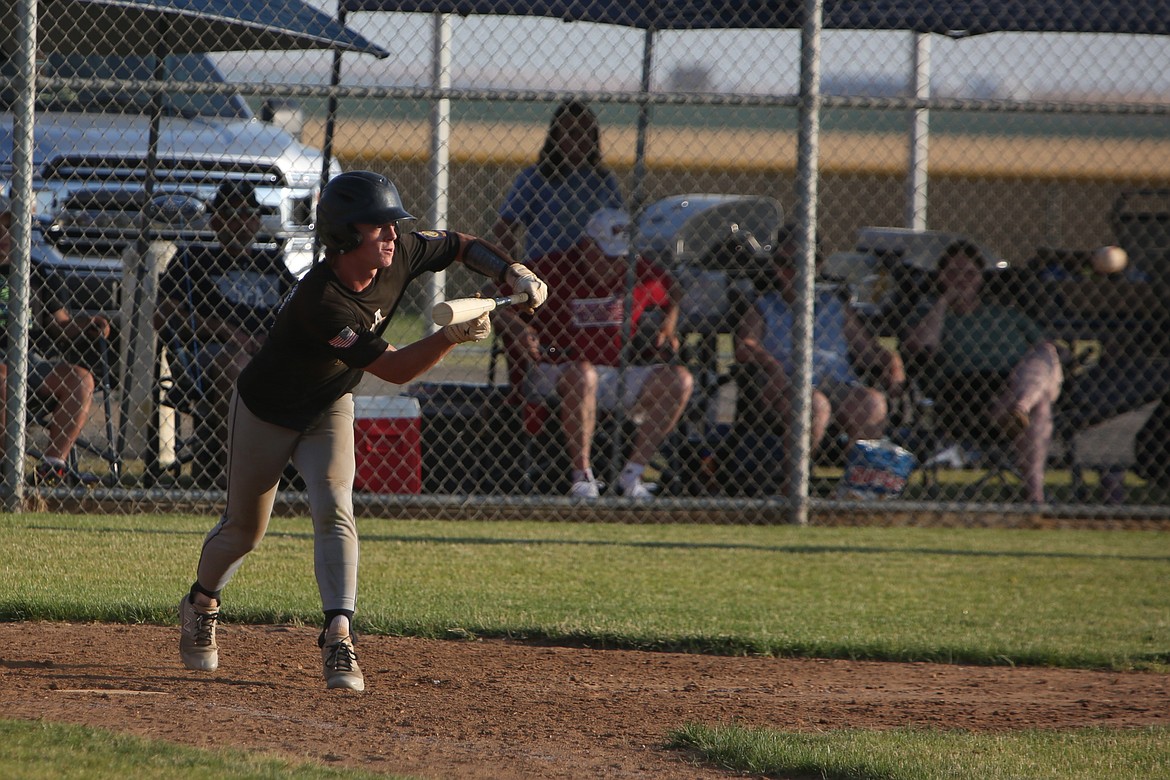 Almira/Coulee-Hartline Legion center fielder Harvest Parrish prepares to lay down a bunt during a game against Gonzaga Prep earlier this month.