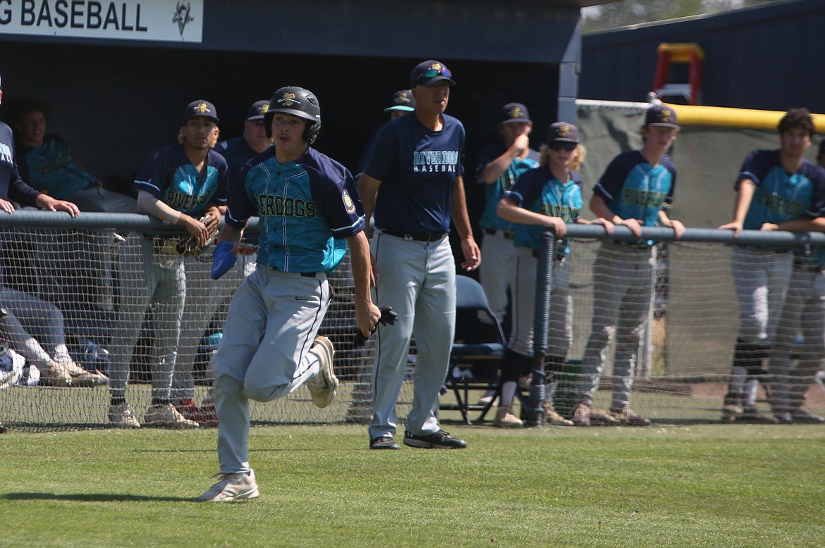 18U AAA River Dog right fielder Adrian Martinez rounds third base before scoring in a game during the River Dog Memorial Tournament, hosted at Big Bend Community College two weekends ago.