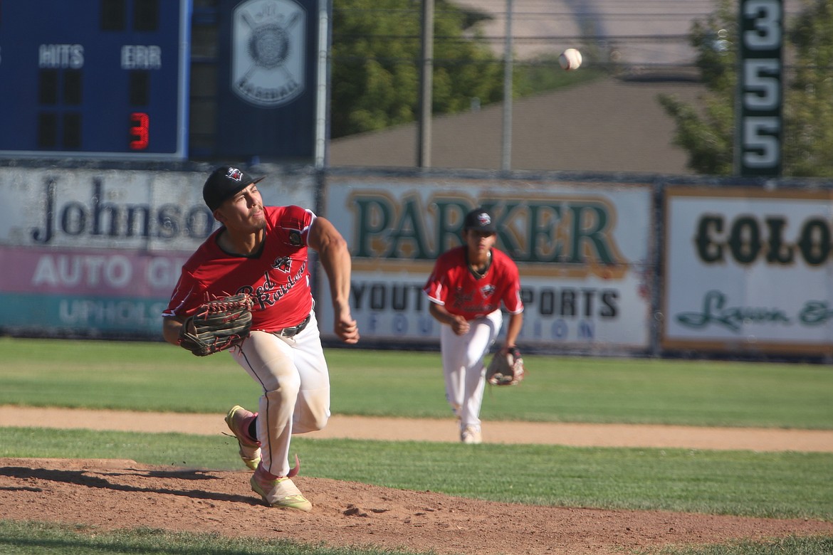 Othello Red Raiders pitcher Kal-El Ozuna unleashes a pitch during a district playoff game against the Walla Walla Bruins on Friday.