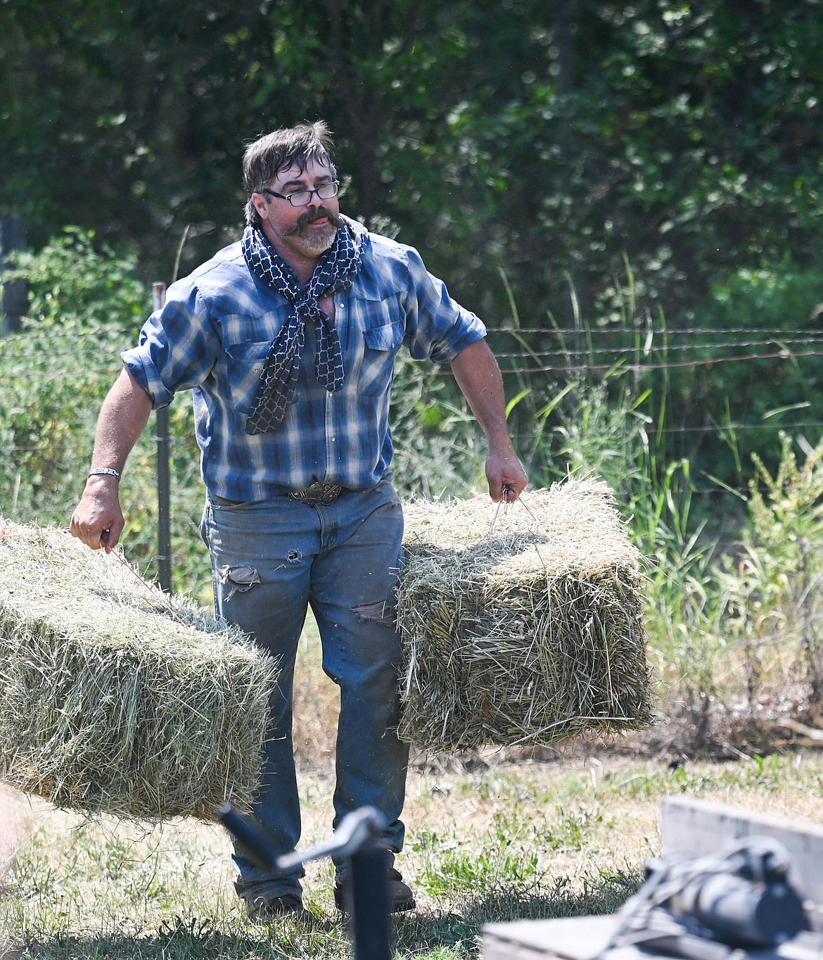 Farmers and ranchers did what they usually do this time of year – move bales of hay around – during the Good Old Days Farmers Olympics. (Christa Umphrey photo)