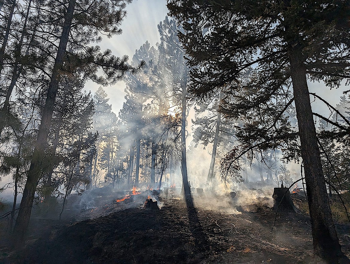 Smoke and flames on the Hubbart Dam Fire Tuesday, July 23, 2024, in Flathead County near Marion. (Marion Fire Department photo)