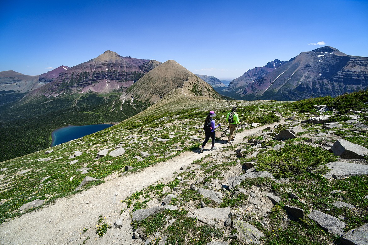 Hikers descend the Continental Divide Trail to Pitamakan Pass in Glacier National Park on Sunday, July 14. (Casey Kreider/Daily Inter Lake)