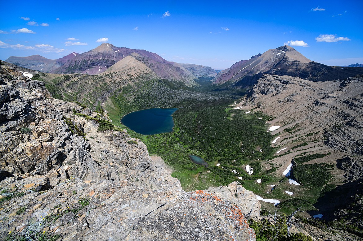 Oldman Lake is shown below Pitamakan Pass with Red Mountain on the left and Rising Wolf Mountain at right in Glacier National Park on Sunday, July 14. (Casey Kreider/Daily Inter Lake)