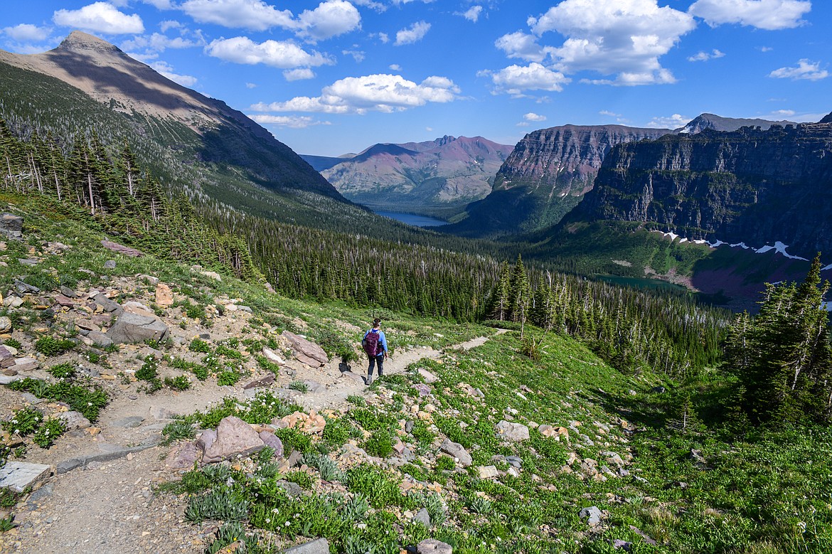 A hiker descends from Dawson Pass towards Two Medicine Lake with No Name Lake at right in Glacier National Park on Sunday, July 14. (Casey Kreider/Daily Inter Lake)