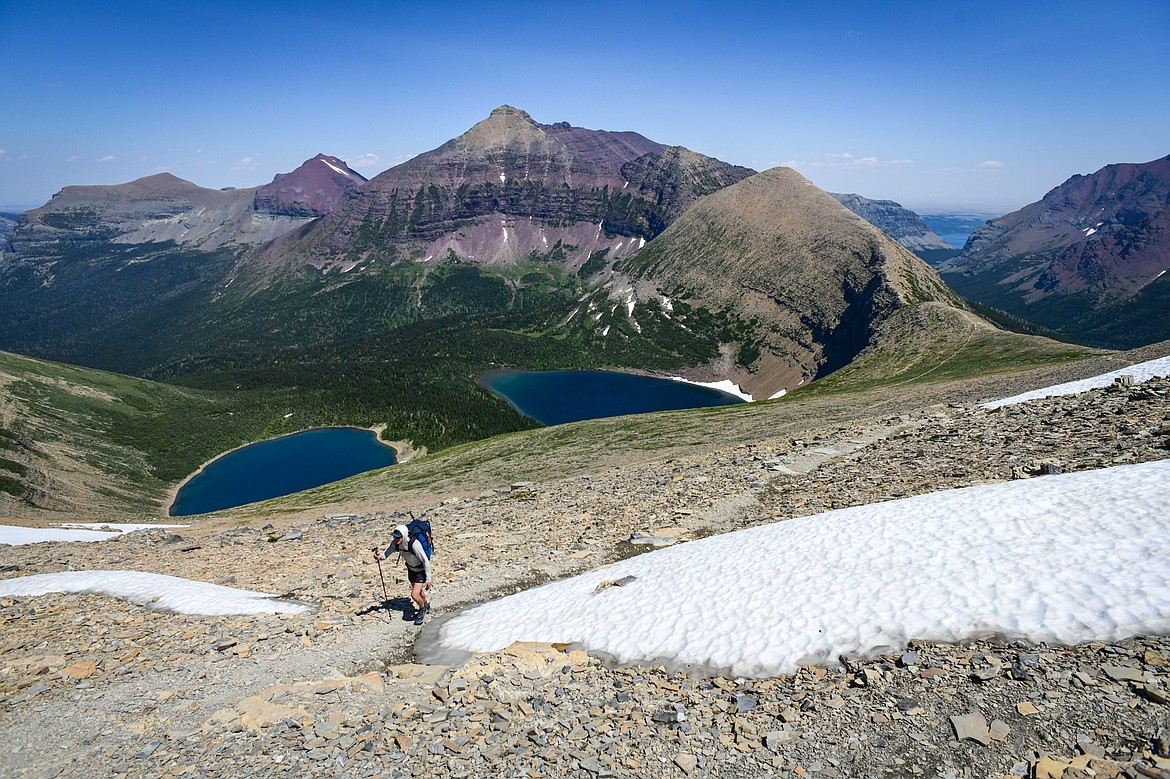 A hiker ascends the Continental Divide Trail above Pitamakan Pass in Glacier National Park on Sunday, July 14. (Casey Kreider/Daily Inter Lake)