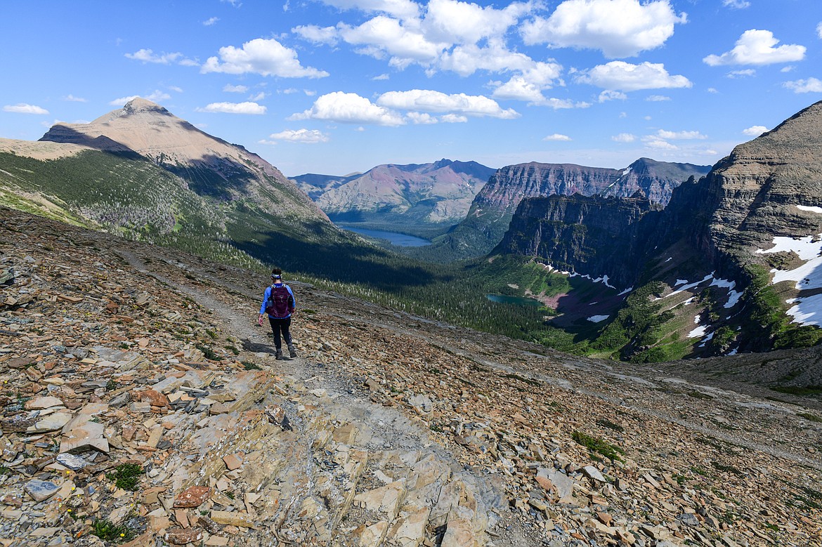 A hiker descends from Dawson Pass towards Two Medicine Lake with No Name Lake at right in Glacier National Park on Sunday, July 14. (Casey Kreider/Daily Inter Lake)