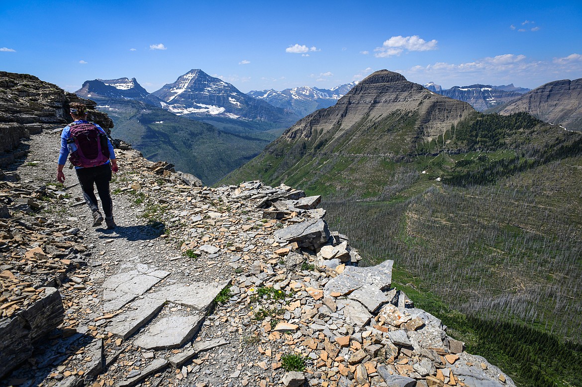 A hiker walks along the Continental Divide Trail between Pitamakan Pass and Dawson Pass in Glacier National Park on Sunday, July 14. (Casey Kreider/Daily Inter Lake)