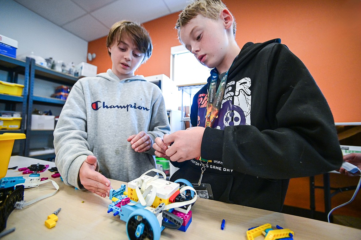 Luke Soteros, left, a seventh-grader, and Kason Browning, right, an eighth-grader strategize the construction and programming of their rover during a Northwest Earth & Space Sciences Pathways Artemis ROADS Mini Mission at West Valley School on Wednesday, July 24. (Casey Kreider/Daily Inter Lake)