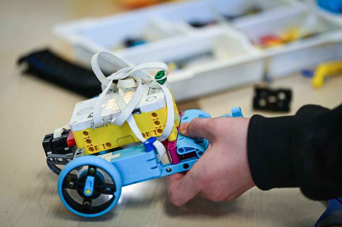 Seventh-grader Kason Browning makes changes to the physical construction of his group's programmable rover during a Northwest Earth & Space Sciences Pathways Artemis ROADS Mini Mission at West Valley School on Wednesday, July 24. (Casey Kreider/Daily Inter Lake)