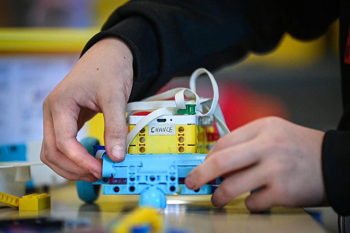 Seventh-grader Kason Browning makes changes to the physical construction of his group's programmable rover during a Northwest Earth & Space Sciences Pathways Artemis ROADS Mini Mission at West Valley School on Wednesday, July 24. (Casey Kreider/Daily Inter Lake)