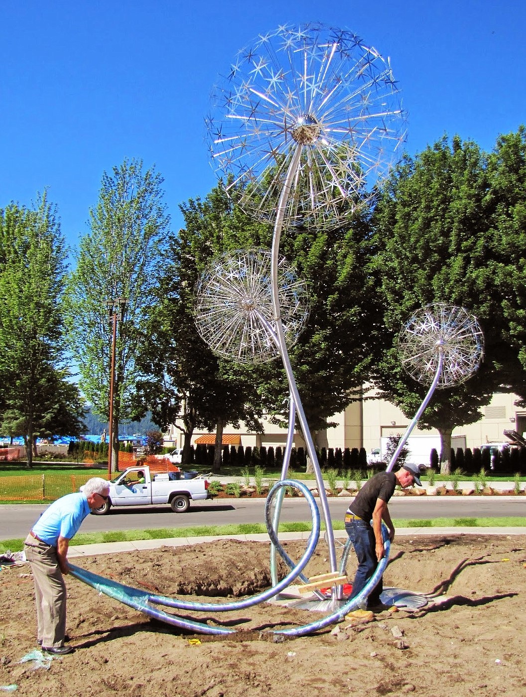 In 2014, parks director Steve Anthony, left, and artist David Tonnesen erected “Allium Spring Chorus” at McEuen Park.