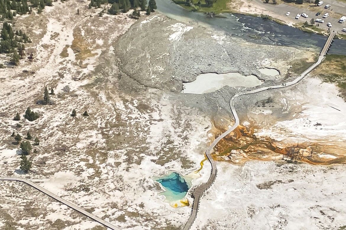 This aerial photo released by the National Park Service shows the damaged Biscuit Basin boardwalks after a hydrothermal explosion at Biscuit Basin in Yellowstone National Park, Wyo., Tuesday, July 23, 2024. (National Park Service via AP)