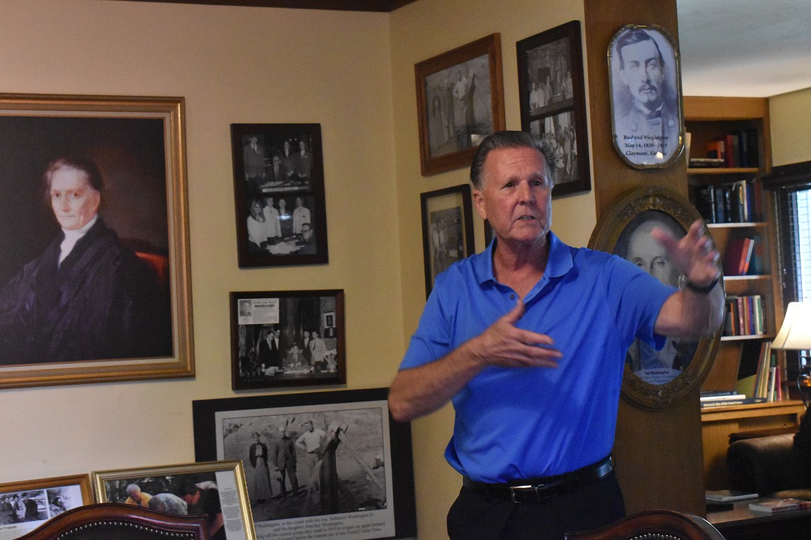 Mike Scellick talks with visitors at the Nat Washington House on Saturday. The house is filled with bits of history.