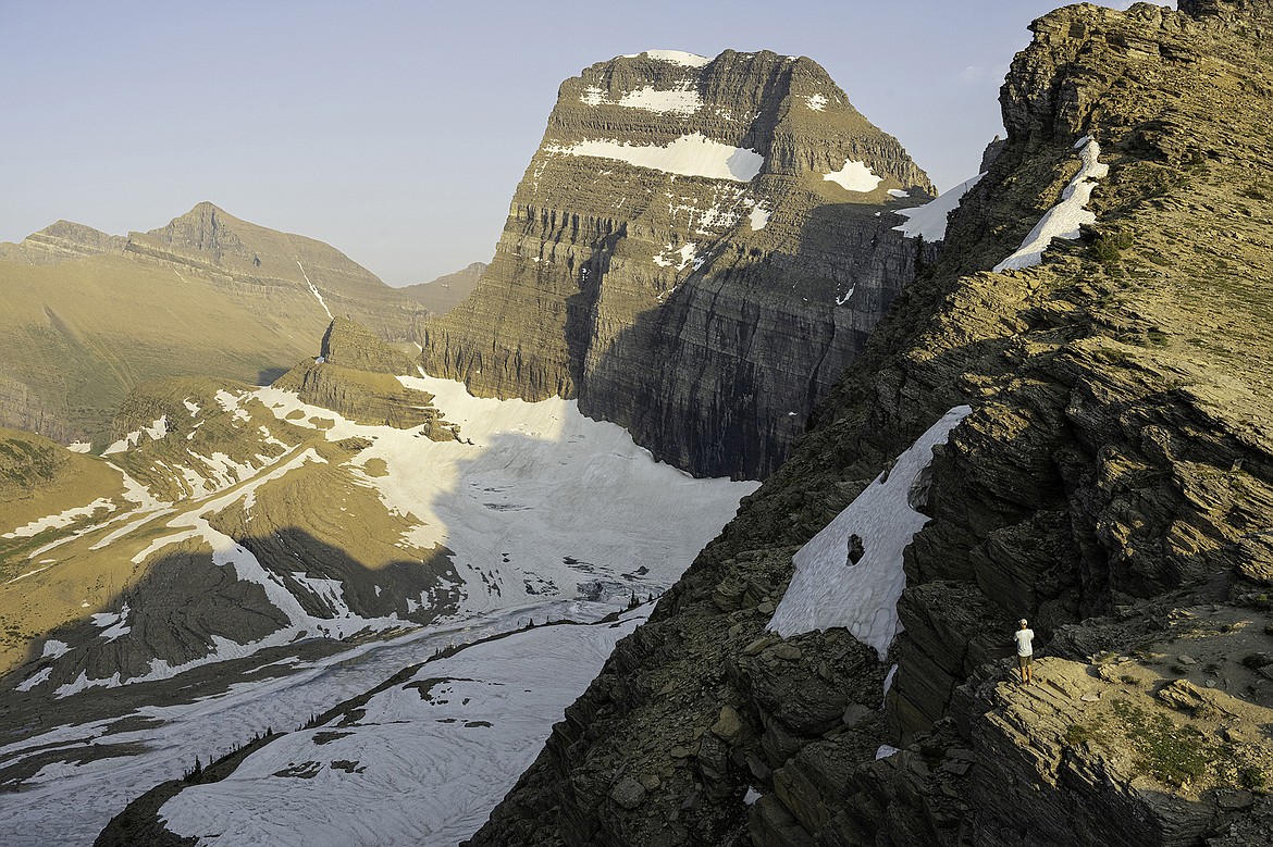 Lane Gyger (seen bottom right) gives scale to Mount Gould (9,557') and the Grinnell Glacier below earlier this month. Seth Anderson Photo