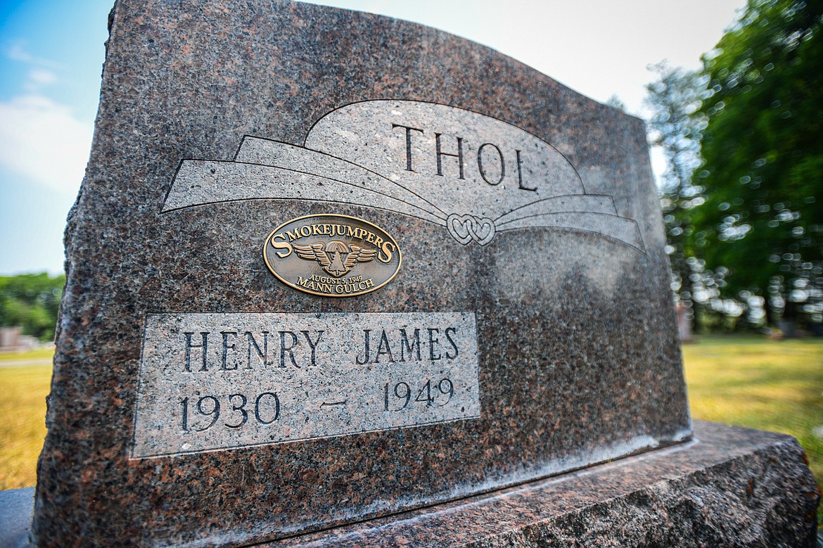 The gravestone of Henry James Thol, one of 13 firefighters who died in the Mann Gulch Fire in August 1949, at C.E. Conrad Memorial Cemetery in Kalispell on Thursday, July 25. (Casey Kreider/Daily Inter Lake)