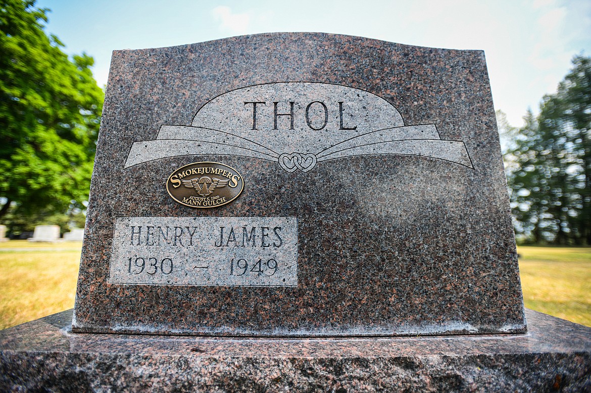 The gravestone of Henry James Thol, one of 13 firefighters who died in the Mann Gulch Fire in August 1949, at C.E. Conrad Memorial Cemetery in Kalispell on Thursday, July 25. (Casey Kreider/Daily Inter Lake)