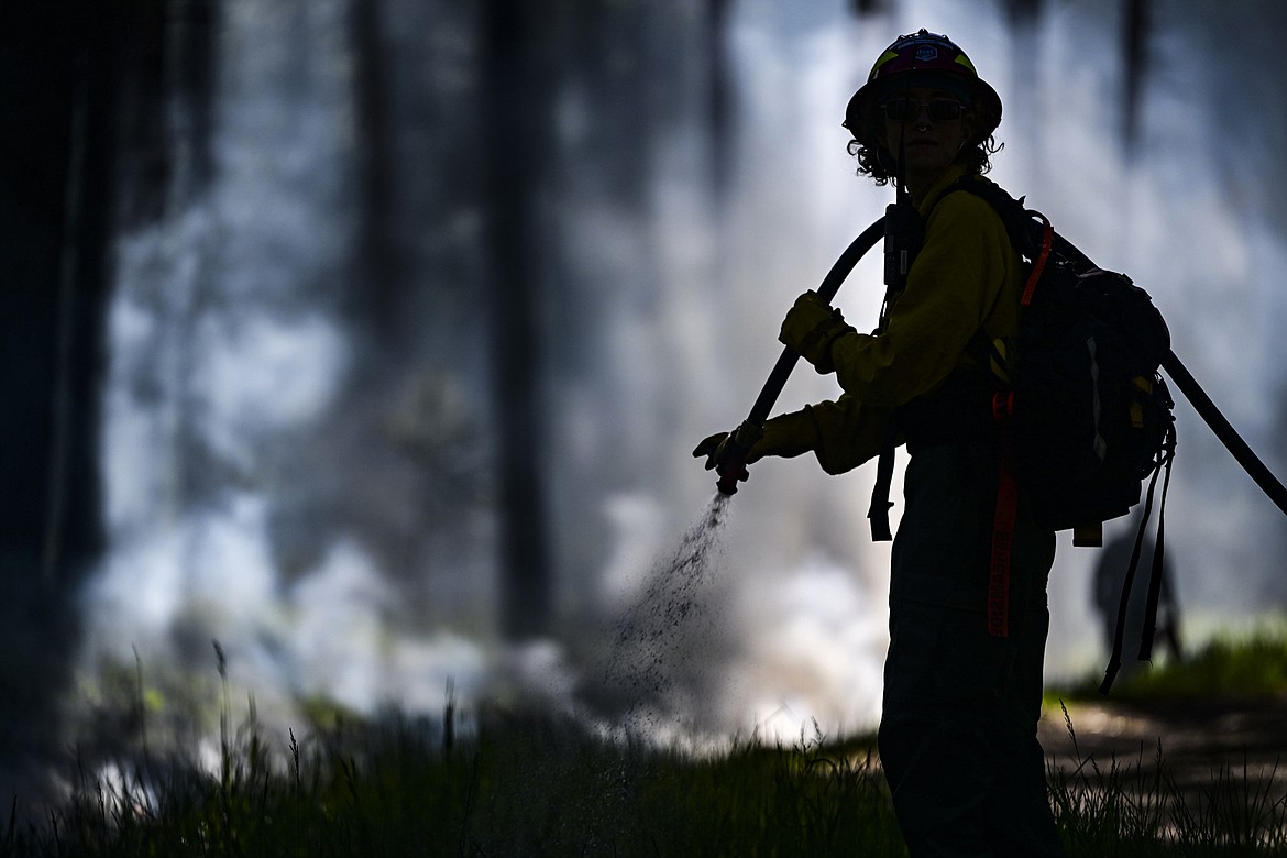 A student works on a controlled burn at UM’s Lubrecht Experimental Forest. (UM photo by Tommy Martino)