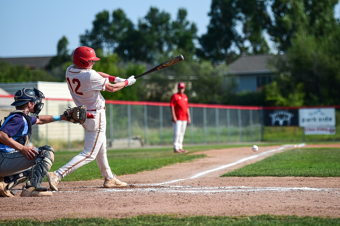 Kalispell's Luke Nikunen (12) drives in Ostyn Brennan with a single in the second inning against Great Falls at Griffin Field on Friday, July 26. (Casey Kreider/Daily Inter Lake)