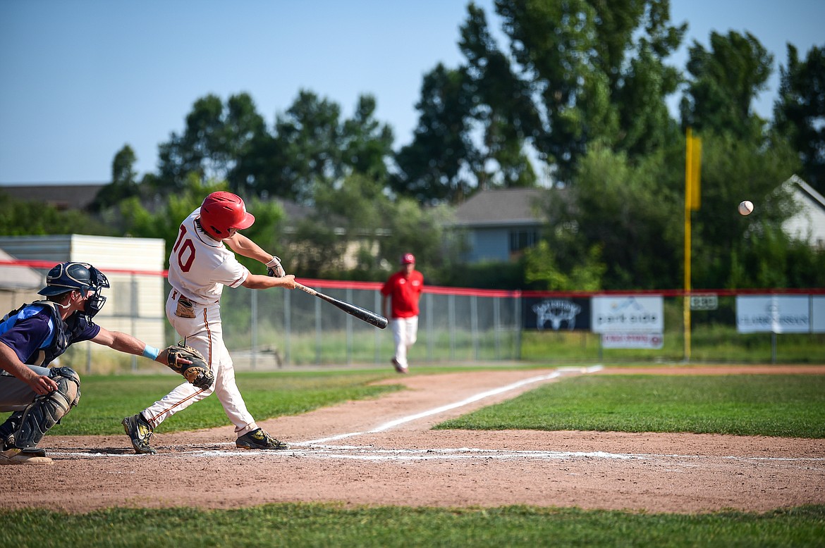 Kalispell's Ostyn Brennan (10) connects on a single in the second inning against Great Falls at Griffin Field on Friday, July 26. (Casey Kreider/Daily Inter Lake)