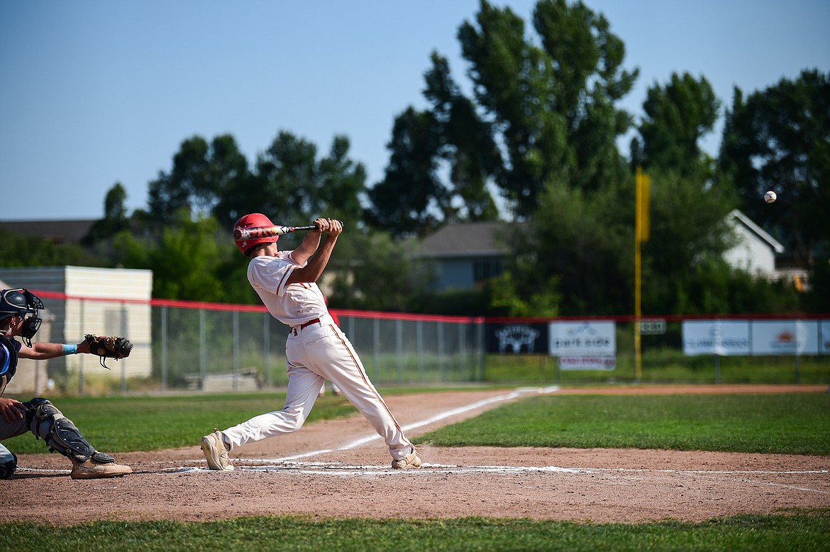 Kalispell's Bryce Buckmaster (17) connects on a single against Great Falls at Griffin Field on Friday, July 26. (Casey Kreider/Daily Inter Lake)