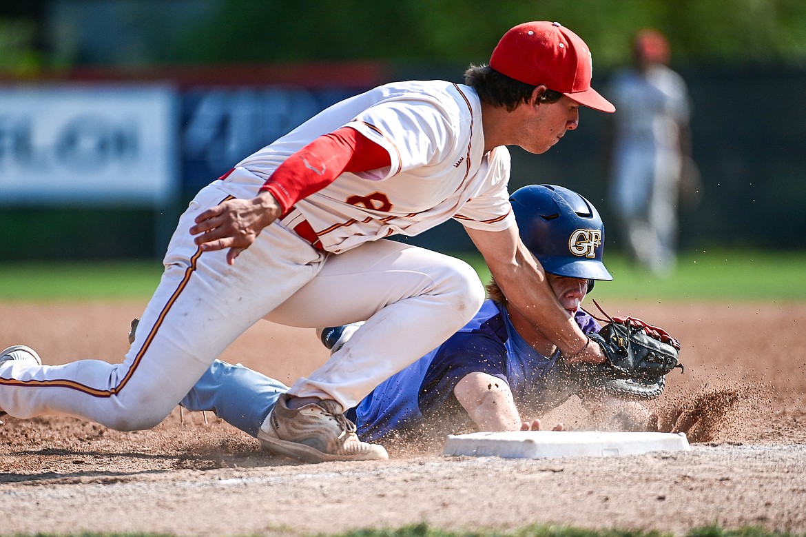 Kalispell first baseman Michael Owens (8) tags out Great Falls' Cole Pace (4) on a snap throw from Lakers catcher Ostyn Brennan in the second inning at Griffin Field on Friday, July 26. (Casey Kreider/Daily Inter Lake)