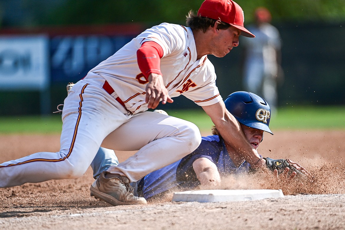 Kalispell first baseman Michael Owens (8) tags out Great Falls' Cole Pace (4) on a snap throw from Lakers catcher Ostyn Brennan in the second inning at Griffin Field on Friday, July 26. (Casey Kreider/Daily Inter Lake)