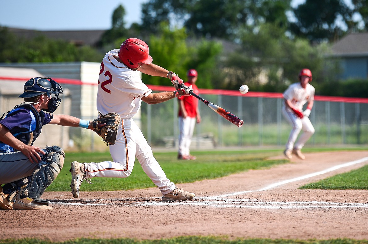 Kalispell's Trever Cockerill (22) drives in two runs with a double in the first inning against Great Falls at Griffin Field on Friday, July 26. (Casey Kreider/Daily Inter Lake)