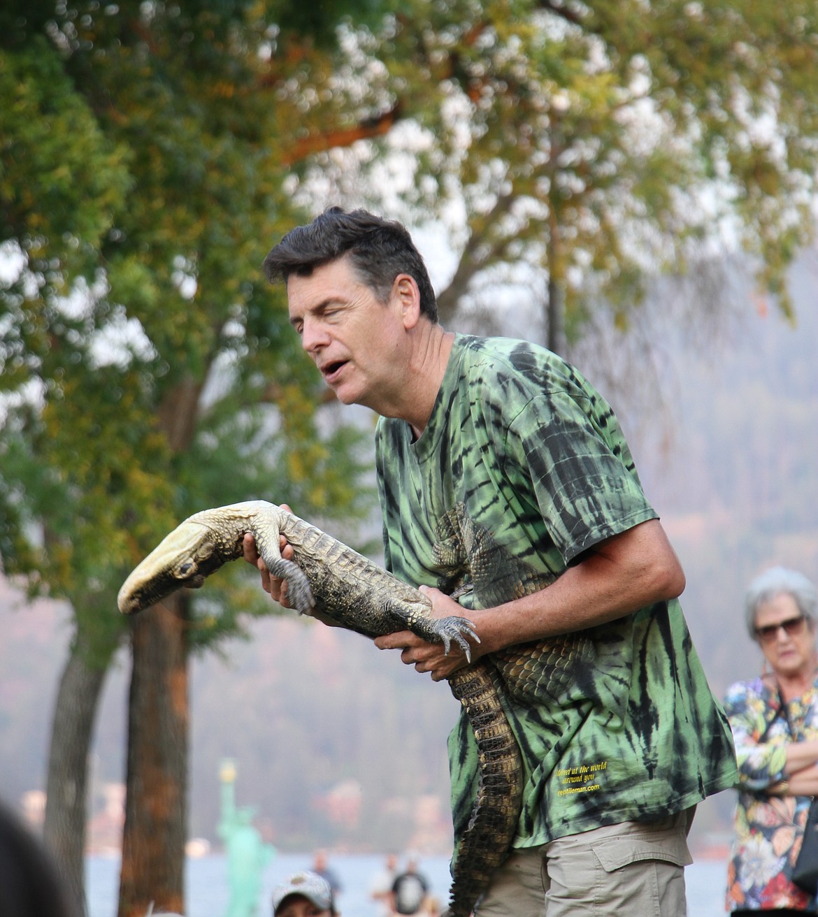 Peterson gently causes an American alligator to pass out in front of the crowd.