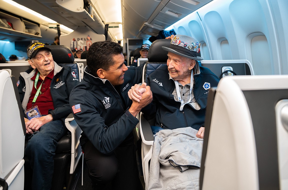 A veteran smiles as he shakes hands with a representative of the Best Defense Foundation.