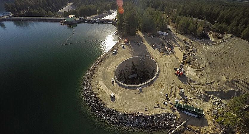 Construction of a fish passage is shown in the photo above. Providing a variety of options for fish to travel around dams helps preserve populations.