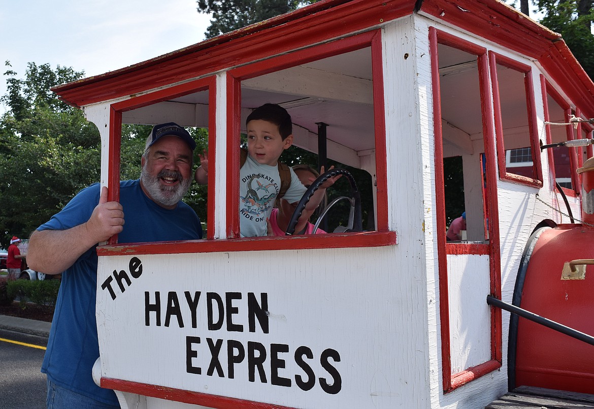 All aboard The Hayden Express! C.J. Reno joined his grandparents, Ron and Maggie Reno, for a ride down Government Way as part of the parade.