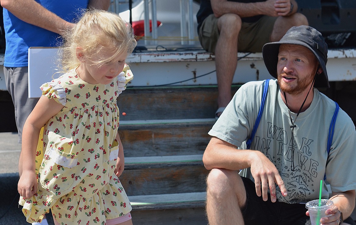 Lili, the only competitor in the 5-and-under category at Saturday's Pit-Spitting Contest plopped her pit six inches from where she was standing, and claimed a bag of Flathead cherries for her effort. (Kristi Niemeyer/Leader)