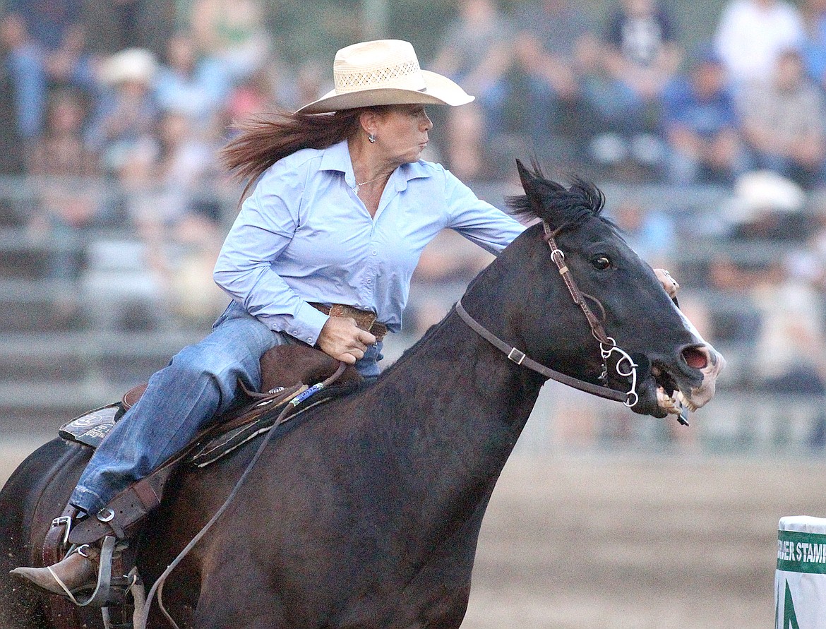 Leslie Penhollow of Prineville, Oregon turns in a time of 17.99 during the barrel racing event Saturday, July 27, 2024, at the Kootenai River Stampede. (Paul Sievers/The Western News)