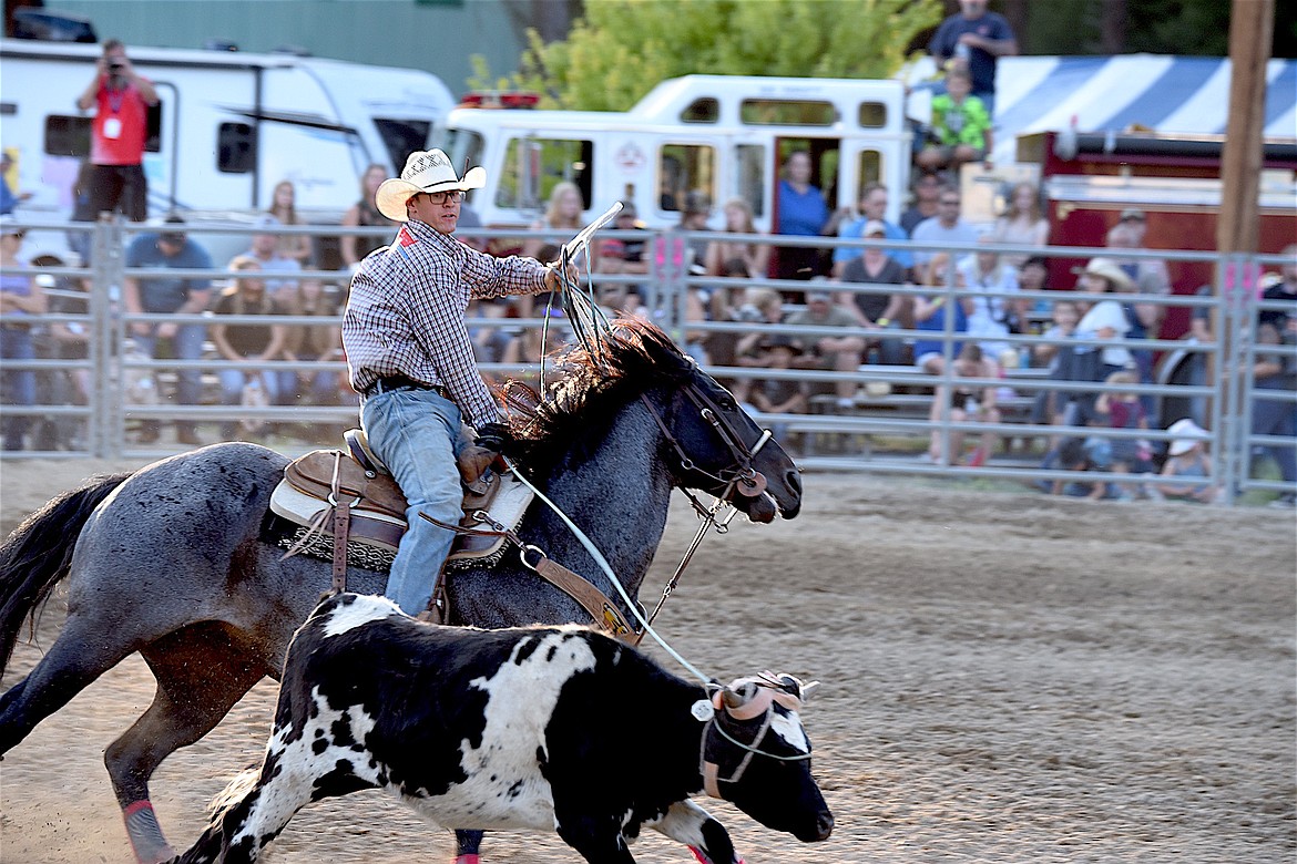 Jaret Whitman of Whitehall, Montana competes in the team roping event Friday, July 26, 2024, at the Kootenai River Stampede in Libby. (Scott Shindledecker/The Western News)