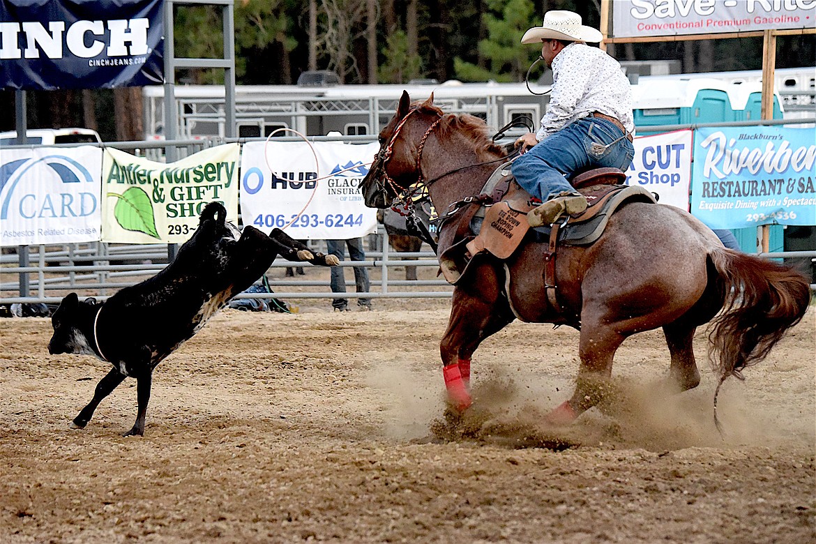 Travis Eller of Hedley, British Columbia competes in the tie down roping event Friday, July 26, 2024, at the Kootenai River Stampede in Libby. (Scott Shindledecker/The Western News)