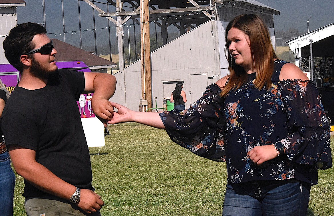 Isaac Cantlon and his partner Hailey Hakes practice western swing dance steps taught by Boots on Fire. A country dance was scheduled for 7 p.m. at the Ronan Fairgrounds last Saturday night. (Berl Tiskus/Leader)