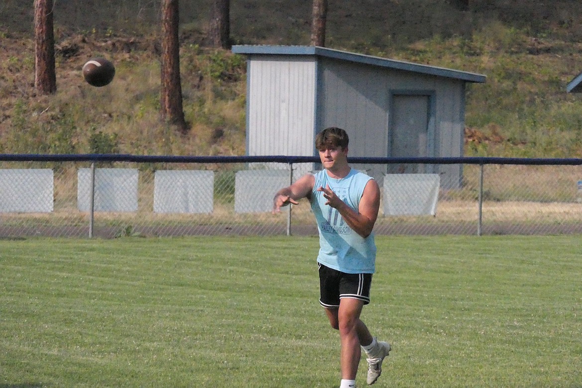 Kaiden Robins, a quarterback prospect for this year's Blue Hawks team releases a pass downfield during a summer workout and conditioning session at the school. (Chuck Bandel/VP-MI)