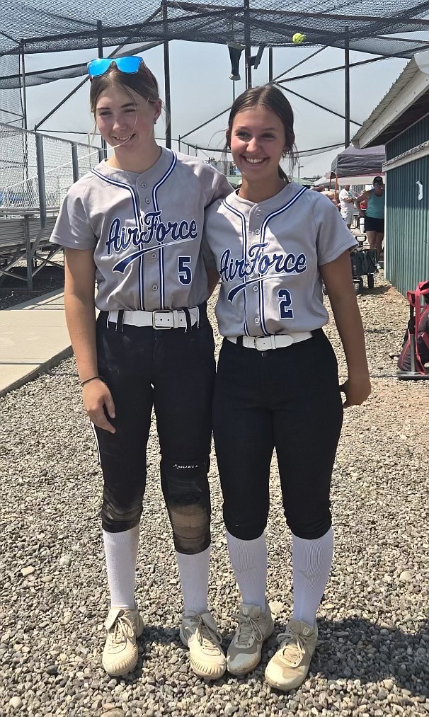 Thompson Falls softball teammates Sarah Koskela (left) and Olivia Fritchett in their Air Force team uniforms during the 11th Annual Veterans Memorial Softball Classic this past weekend in Belgrade.  (Photo by Jared Koskela)