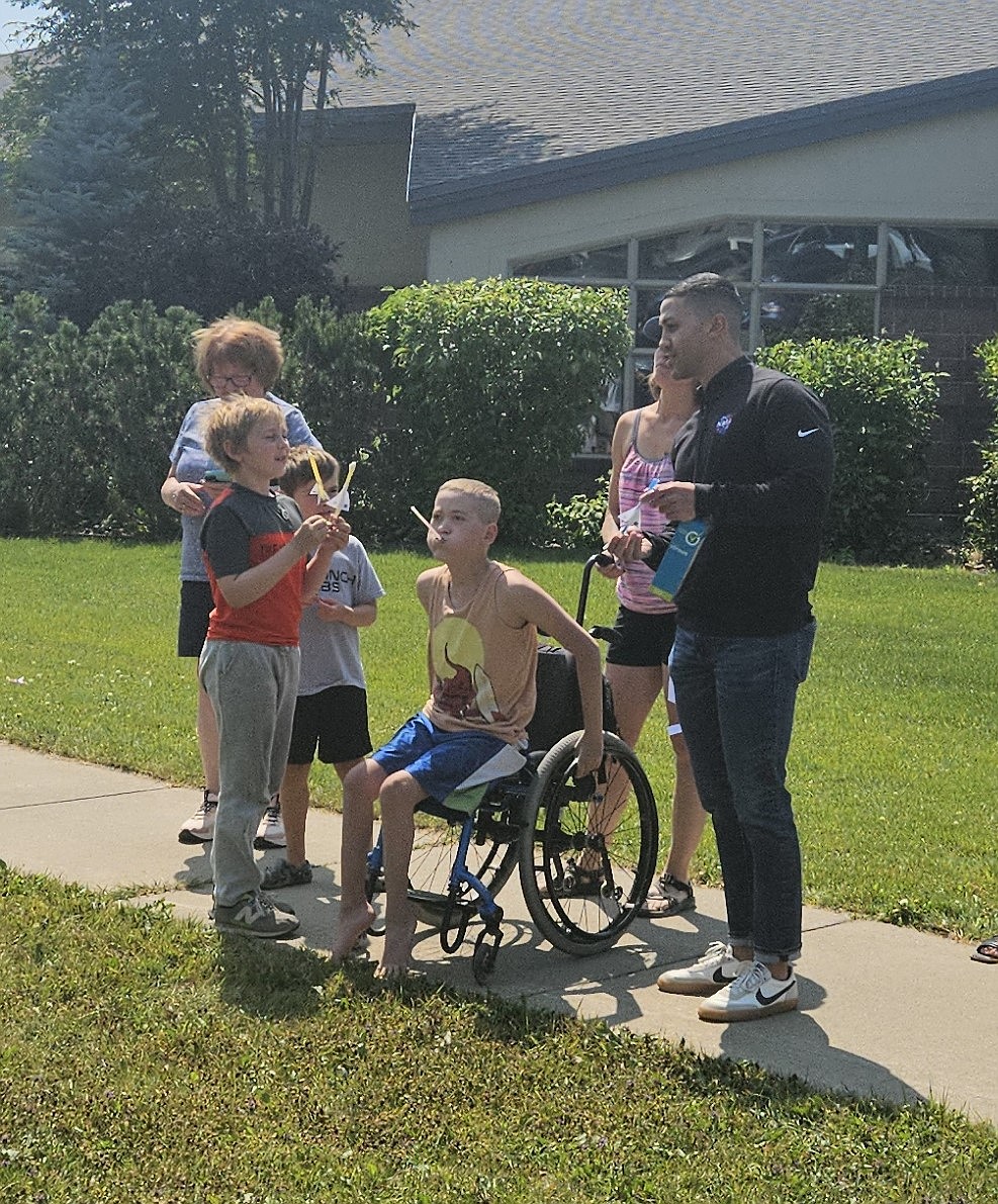 Jarrod Bales, right, teaching kids how to launch their rockets on Friday. (Photo provided by Whitefish Community Library)