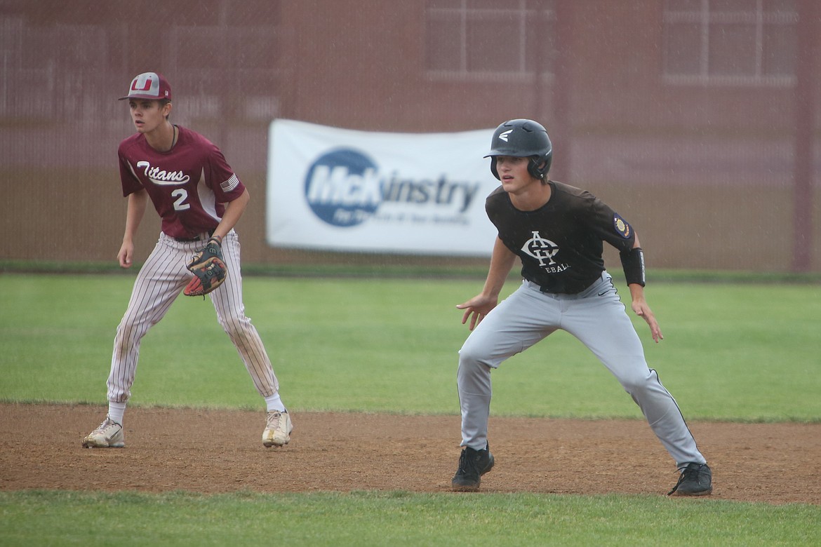 Almira/Coulee-Hartline right fielder Josh Booker, right, leads off second base in the bottom of the fourth inning against Spokane Valley in the quarterfinals of the Division B bracket at the AA State Tournament.