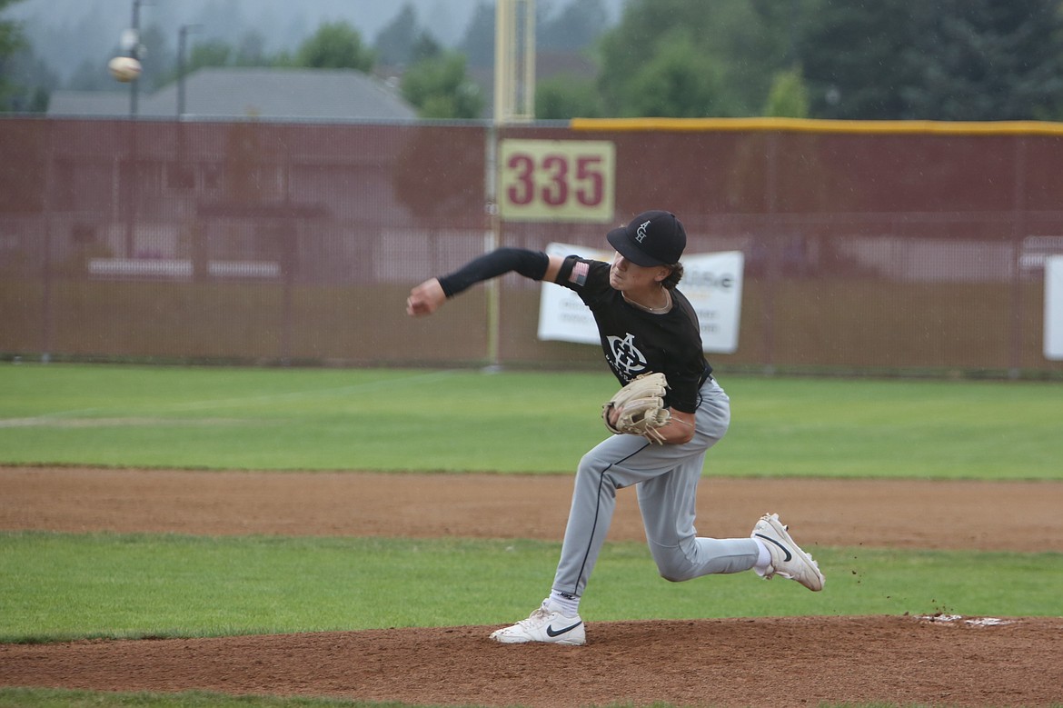 Warrior pitcher Karson Thompson releases a pitch against Spokane Valley on Monday during a game in the AA State Tournament.