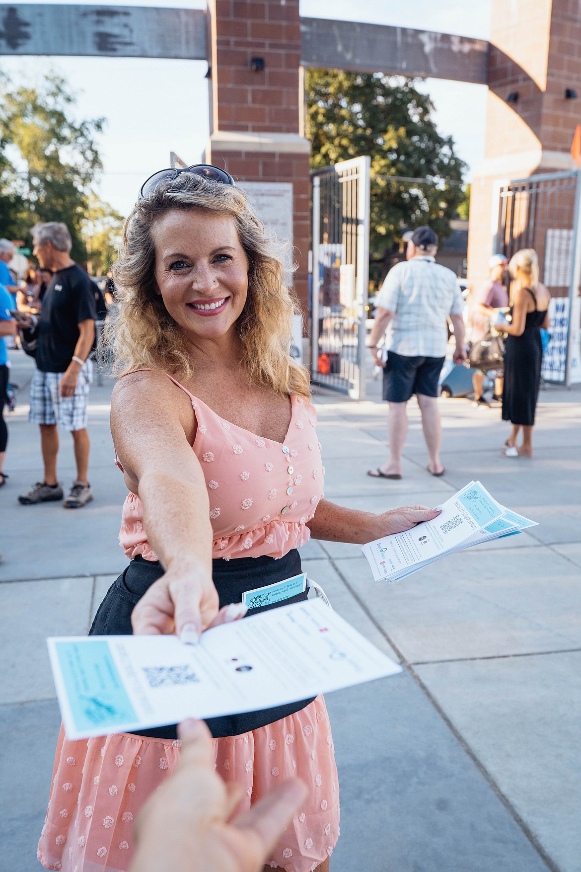 A volunteer greeter welcomes a guest to a past Festival show.