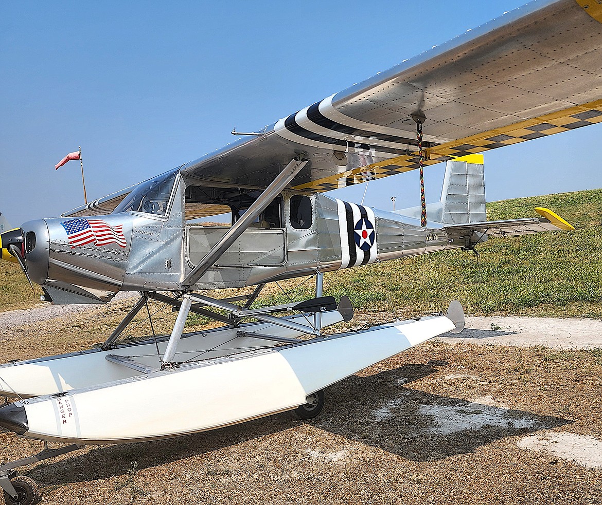 Another float plane joins Herb Lingl's at the Polson Fairgrounds Inc.'s dock on the Flathead River. This plane is an amphibian so it can touch down on water or land. (Berl Tiskus/Leader)