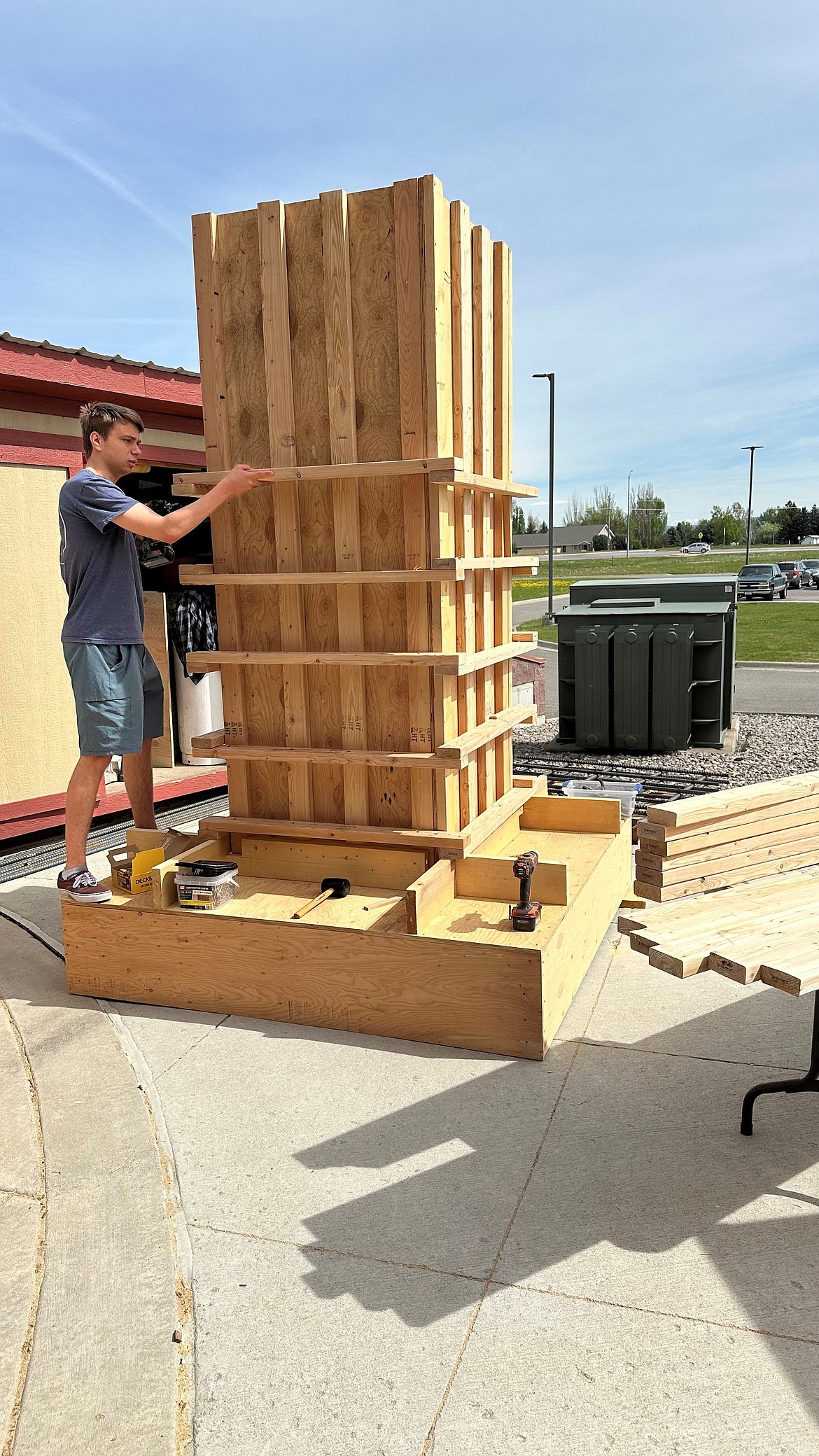 Glacier High School student Robert Knowles adds 2-by-4 bracing to reinforce the footing and pier form. (Photo provided by C.J. Cummings)