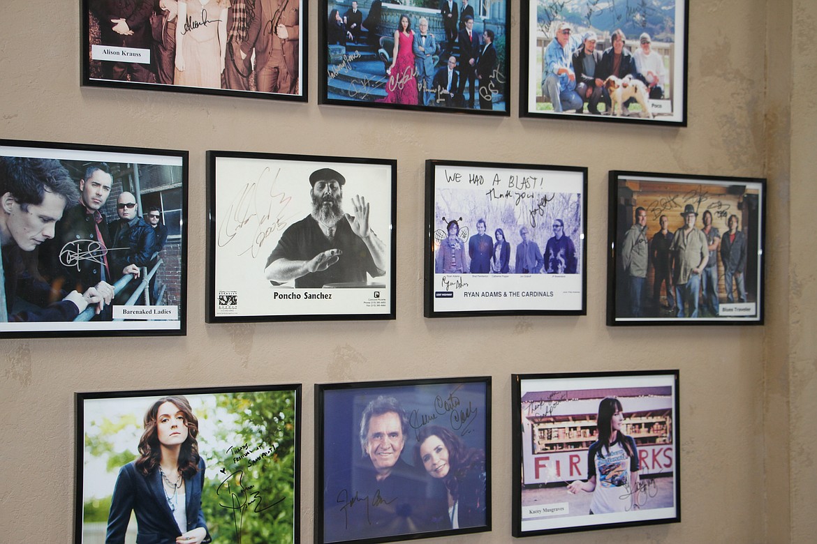 Signed photos from visiting acts including Barenaked Ladies, Kacey Musgraves, and many more cover the walls of the Festival at Sandpoint office.