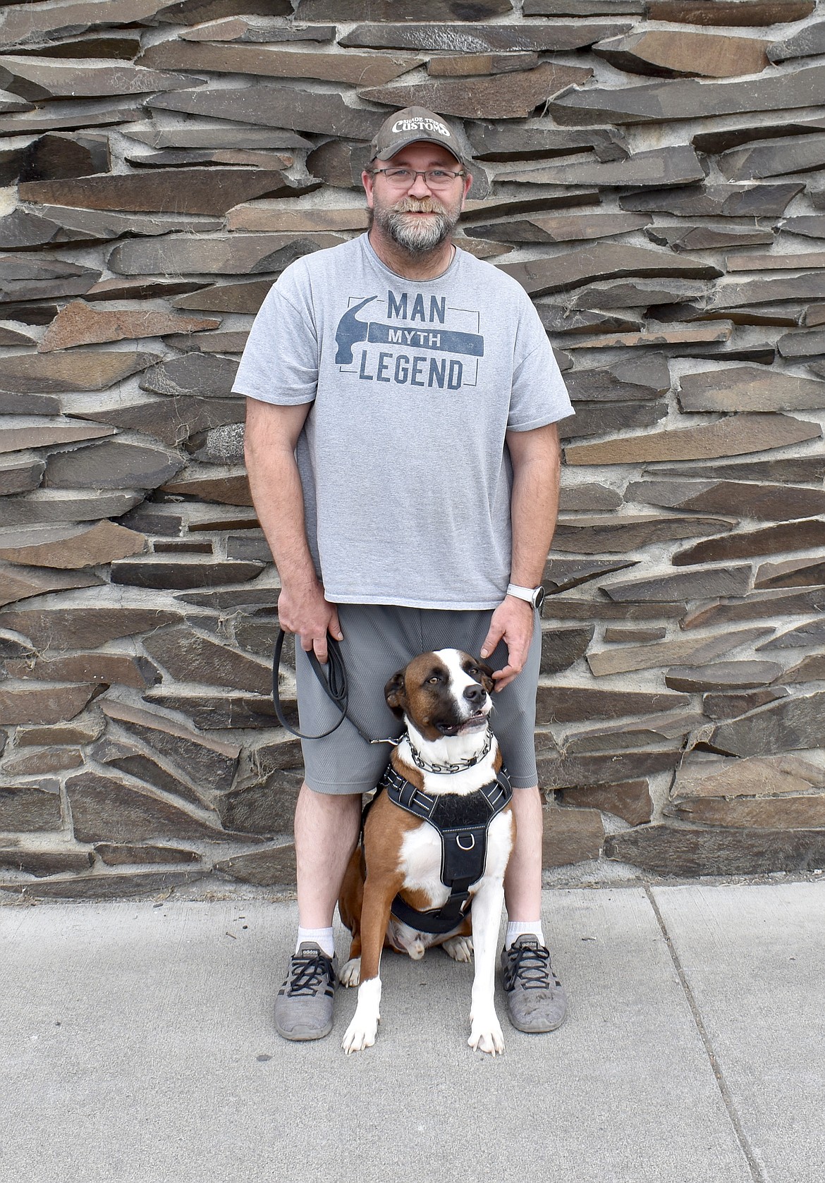 Army National Guard veteran Kris Hemmerling stands with his service dog Dallas. The American Legion and Auxiliary in Ephrata, which helped Hemmerling get his dog in 2019, is holding a dinner and auction Aug. 10 to help more veterans find their battle buddies.