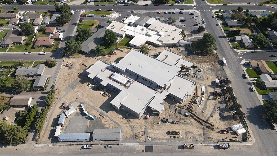 The new and old Quincy Valley Medical Centers sit side by side. The new hospital is about halfway to its opening.