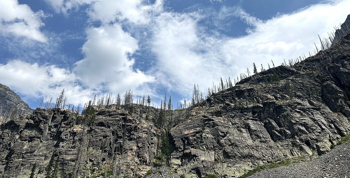 Cliffs surround Snyder Lake at Glacier National Park.