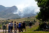 Wildfires encroach on homes near Denver as heat hinders fight