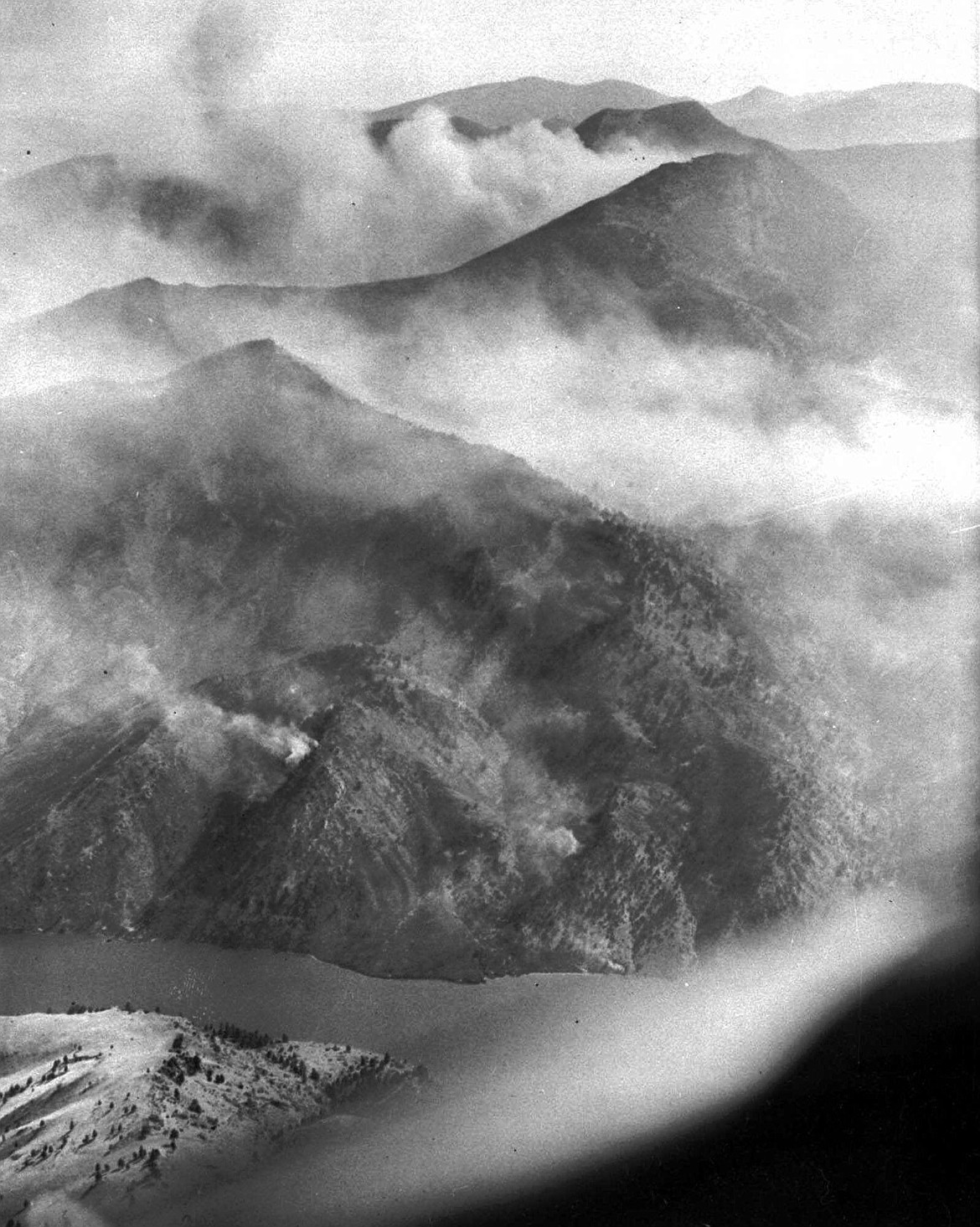 An August 1949 photo shows the scope of the Mann Gulch fire near Helena, Mont., which took the lives of 12 smokejumpers and a forest ranger when a wall of flame raced up a steep hillside. The lightning-caused blaze burned more than 3,000 acres and controlling it required the efforts of more than 400 firefighters. (AP Photo)